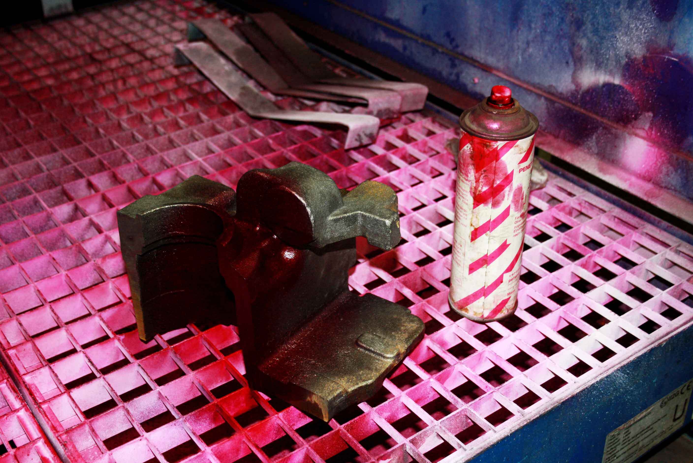 absense of cracks-iron castings-axle-bearing non-magnetic iron castings made as Ni-Resist are checked by dye penetration process ( PT ) for absense of cracks – parts with failures are recycled in the furnace