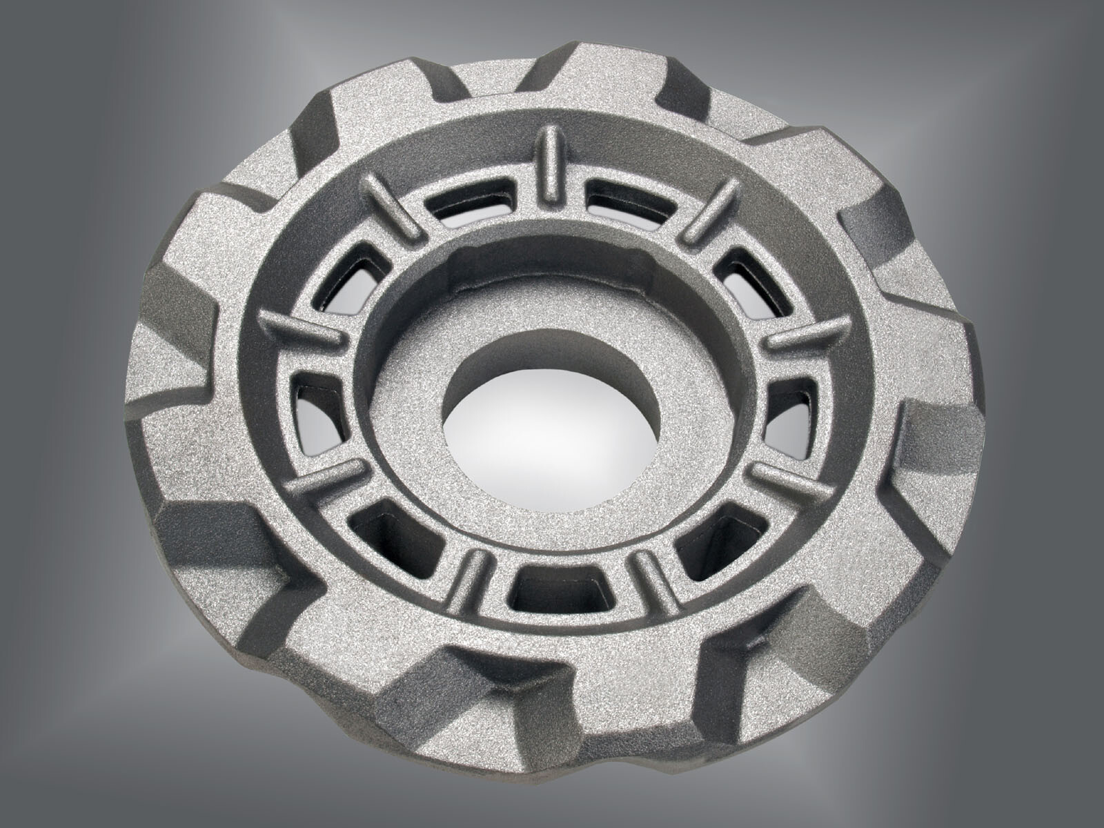 traction wheel for drivetrain application of a handling robot made of ductile cast iron with 150 kg part weight.